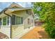 Home with siding, a well-maintained driveway, and surrounding greenery creating a serene environment at 4163 Otterbein Ave, Indianapolis, IN 46227