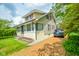 Well-maintained two-story home with classic architecture, complemented by lush lawn and gravel driveway at 4163 Otterbein Ave, Indianapolis, IN 46227