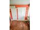 Hallway featuring hardwood floors, built-in cupboard and a door leading to other rooms at 4163 Otterbein Ave, Indianapolis, IN 46227
