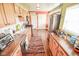 Charming kitchen with stainless steel appliances, ample cabinetry, and hardwood floors at 4163 Otterbein Ave, Indianapolis, IN 46227