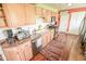 Cozy kitchen with stainless steel appliances, ample cabinetry, and hardwood floors at 4163 Otterbein Ave, Indianapolis, IN 46227