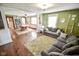 Open-concept living room and dining room boasts hardwood floors and lots of natural light at 4163 Otterbein Ave, Indianapolis, IN 46227