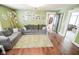 Spacious living room featuring a comfortable gray sofa and bright green walls at 4163 Otterbein Ave, Indianapolis, IN 46227
