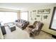 Inviting living room with a large window, plush seating, and decorative wall art at 4163 Otterbein Ave, Indianapolis, IN 46227
