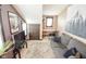 Living room featuring a gray couch, tv and an office space at 4163 Otterbein Ave, Indianapolis, IN 46227