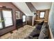 Living space with a comfortable couch, a TV, and windows providing natural light at 4163 Otterbein Ave, Indianapolis, IN 46227