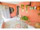 Charming sunroom with wainscoting, a cozy seating area, and access to the outdoors at 4163 Otterbein Ave, Indianapolis, IN 46227