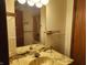 Bathroom with a stone-look vanity top and a shower-tub combo with a shower curtain at 4336 Abby Creek Ln, Indianapolis, IN 46205