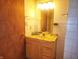 Bathroom featuring a marble-look sink on a wood vanity at 4336 Abby Creek Ln, Indianapolis, IN 46205