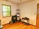 Bedroom featuring hardwood floors, window, and door at 4336 Abby Creek Ln, Indianapolis, IN 46205