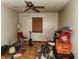 This bedroom features hardwood floors, a ceiling fan and window at 4336 Abby Creek Ln, Indianapolis, IN 46205