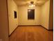 Living room features hardwood floors and natural light from two windows at 4336 Abby Creek Ln, Indianapolis, IN 46205