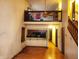 Open-concept living room with hardwood floors, a breakfast bar, and a staircase to the second floor at 4336 Abby Creek Ln, Indianapolis, IN 46205