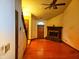 Spacious living room with hardwood floors, fireplace, and staircase at 4336 Abby Creek Ln, Indianapolis, IN 46205