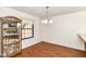 Dining area featuring stylish laminate flooring, natural light, and ample space for Gathering gatherings at 4504 Harvard Dr, Anderson, IN 46013