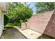 Outdoor patio surrounded by a brick wall and nearby lush greenery for additional privacy at 4504 Harvard Dr, Anderson, IN 46013