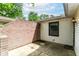 A cozy brick patio is partially enclosed by a brick wall, perfect for outdoor living at 4504 Harvard Dr, Anderson, IN 46013