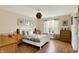 Cozy bedroom with wood floors, natural light, and tasteful decor at 482 Sycamore St, Brownsburg, IN 46112