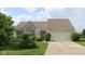 Charming single-story home with a well-maintained lawn and attached two-car garage at 482 Sycamore St, Brownsburg, IN 46112