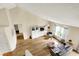 Upper view of a cozy living room showcasing hardwood floors and an open layout at 482 Sycamore St, Brownsburg, IN 46112