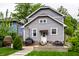 Backyard featuring stylish furniture, a wooden deck, and lots of greenery at 5015 N Park Ave, Indianapolis, IN 46205