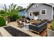 Backyard featuring an outdoor living area, fire pit, seating, and green landscaping at 5015 N Park Ave, Indianapolis, IN 46205