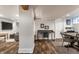 Open concept basement with living and dining areas connected by hardwood flooring at 5015 N Park Ave, Indianapolis, IN 46205