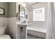 Charming bathroom featuring a pedestal sink, subway tile, and mosaic floor at 5015 N Park Ave, Indianapolis, IN 46205