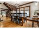 Open dining area with wooden table, black chairs, and natural light at 5015 N Park Ave, Indianapolis, IN 46205