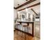 Eat-in kitchen area with bar seating, pendant lights, and hardwood floors at 5015 N Park Ave, Indianapolis, IN 46205