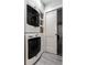 Well-equipped laundry room with stacked washer and dryer, providing space-saving convenience at 5015 N Park Ave, Indianapolis, IN 46205