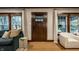 Bright living room featuring hardwood floors, neutral walls, and dark trim at 5015 N Park Ave, Indianapolis, IN 46205