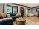 Comfortable living room with hardwood floors, a sectional sofa, and ample natural light at 5015 N Park Ave, Indianapolis, IN 46205