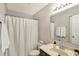 Cozy full bathroom with a shower/tub combo with shower curtain and a traditional vanity at 5041 Millwright Ct, Indianapolis, IN 46254
