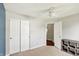 Bedroom with neutral carpet, closet doors, and open doorway to adjoining room at 5041 Millwright Ct, Indianapolis, IN 46254