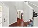 Entry foyer with hardwood floors, a view into the living area and a staircase to the upper level at 5041 Millwright Ct, Indianapolis, IN 46254