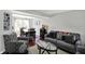 An open living space flows into the dining area offering comfortable seating and lots of natural light at 5041 Millwright Ct, Indianapolis, IN 46254