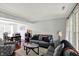 Spacious living room flowing into the dining area, featuring neutral decor and lots of natural light at 5041 Millwright Ct, Indianapolis, IN 46254