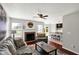 Cozy living area seamlessly blending into an open kitchen space and fireplace at 5041 Millwright Ct, Indianapolis, IN 46254