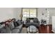 Cozy living room features natural light, comfortable seating, and modern decor at 5041 Millwright Ct, Indianapolis, IN 46254