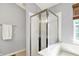 Bathroom highlighting a glass-enclosed shower with updated fixtures and a towel bar for convenience at 5041 Millwright Ct, Indianapolis, IN 46254