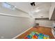 Unfinished basement with hardwood floors, neutral paint, and ample space for storage and recreation at 5117 N Park Ave, Indianapolis, IN 46205