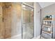 This is a shower with tiled walls, a built-in niche, and sliding glass doors at 5117 N Park Ave, Indianapolis, IN 46205
