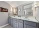 This is a bathroom with dual sinks, vanity lighting, and modern faucets at 5117 N Park Ave, Indianapolis, IN 46205