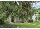 Lush front yard with mature trees adding privacy and shade to the charming home at 5117 N Park Ave, Indianapolis, IN 46205