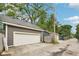 Multiple car garage spaces with a concrete driveway at 5117 N Park Ave, Indianapolis, IN 46205