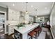 The kitchen features an island with seating and stainless appliances at 5117 N Park Ave, Indianapolis, IN 46205
