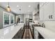 The kitchen features stainless appliances, white subway tile, and a gas cooktop at 5117 N Park Ave, Indianapolis, IN 46205