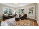 Comfortable living room with hardwood floors, ample seating, and a bright, airy atmosphere at 5117 N Park Ave, Indianapolis, IN 46205