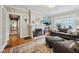 Bright living room with hardwood floors, a fireplace, and comfortable seating area at 5117 N Park Ave, Indianapolis, IN 46205